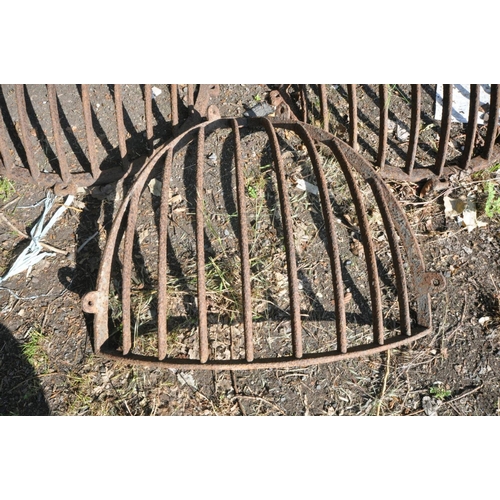 1201 - A VINTAGE CAST IRON CORNER HAY FEEDER, width 80cm x height 84cm, and a pair of vintage cast iron fla... 