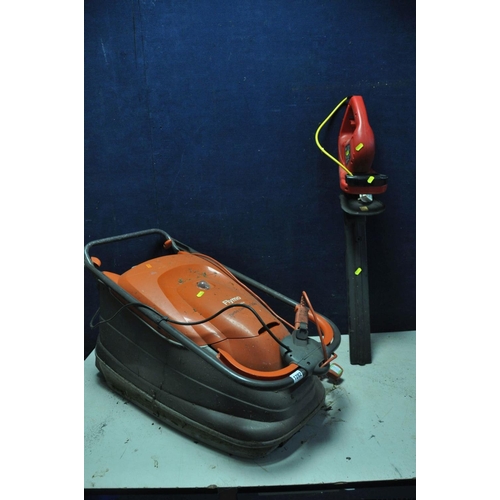 1282 - A FLYMO TC330 turbo compact lawn mower along with a Champion CM420HT hedge trimmer (with short cable... 