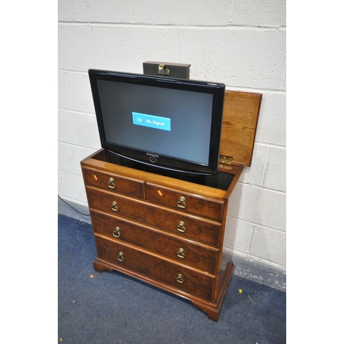 1520 - A REPRODUCTION WALNUT TV CABINET, a rise and fall tv bracket, fitted with a Samsung LE23R87BD 23inch... 