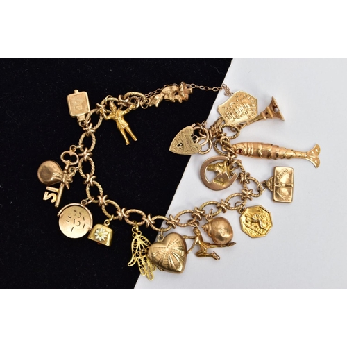 1 - A 9CT GOLD CHARM BRACELET, twisted oval link bracelet  fitted with a heart padlock clasp hallmarked ... 