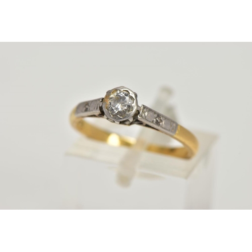 10 - A YELLOW AND WHITE METAL SINGLE STONE DIAMOND RING, collet mounted round brilliant cut diamond, esti... 