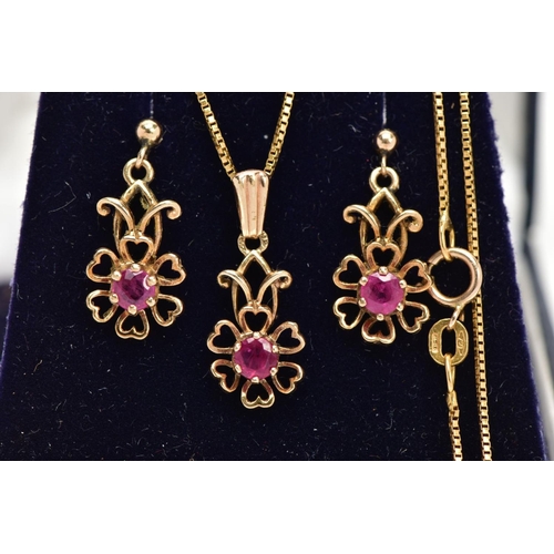 15 - A MATCHING PENDANT NECKLACE AND EARRING SET, the pendant designed as an openwork flower, set with a ... 