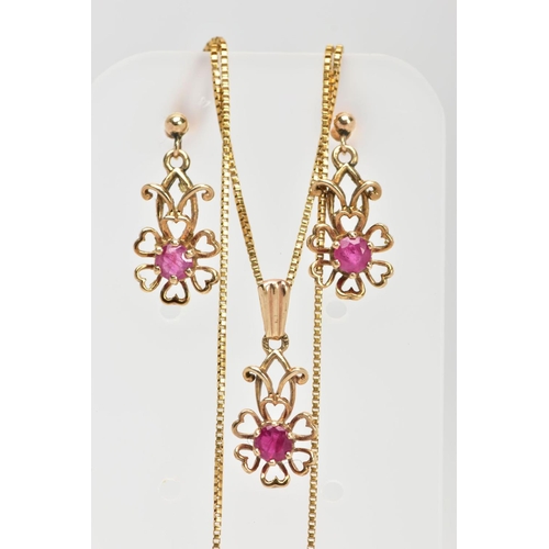 15 - A MATCHING PENDANT NECKLACE AND EARRING SET, the pendant designed as an openwork flower, set with a ... 