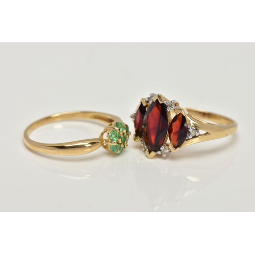 27 - TWO 9CT GOLD GEM SET RINGS, the first designed with three graduating marquise cut garnets, single cu... 