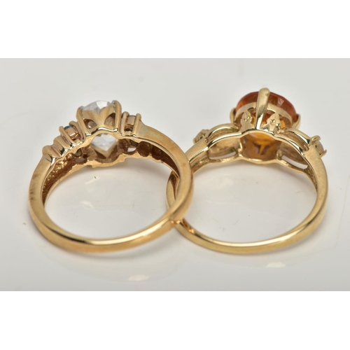 30 - TWO 9CT GOLD GEM SET DRESS RINGS, the first centring on a four claw set, circular cut citrine, flank... 