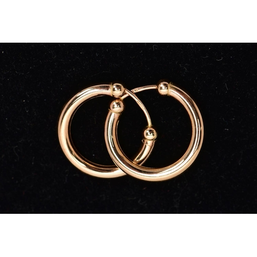 33 - A PAIR OF 9CT GOLD EARRINGS, each hollow ear hoop of plain polished design with spherical bead accen... 