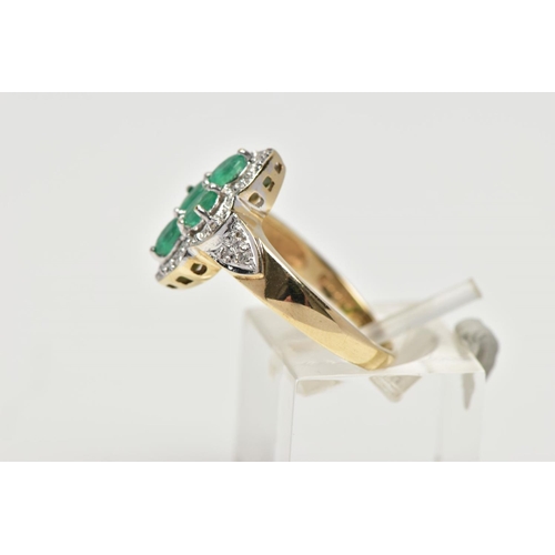 49 - A 9CT YELLOW AND WHITE GOLD  EMERALD AND DIAMOND DRESS RING, set with four oval cut emeralds, within... 