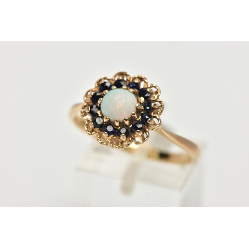 50 - A 9CT YELLOW GOLD SAPPHIRE AND OPAL CLUSTER RING, set with a principal opal cabochon, surrounded by ... 