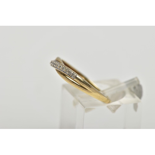 55 - A 9CT YELLOW GOLD DIAMOND CROSSOVER BAND RING, set with thirteen single cut diamonds, claw set to th... 