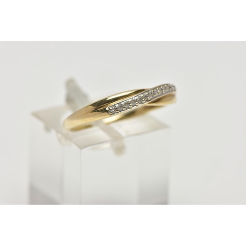 55 - A 9CT YELLOW GOLD DIAMOND CROSSOVER BAND RING, set with thirteen single cut diamonds, claw set to th... 