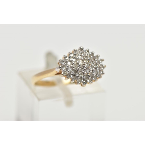 57 - A 9CT YELLOW GOLD DIAMOND DRESS RING, the tiered cluster set throughout with approximately forty-thr... 