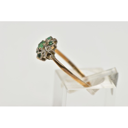 58 - A 9CT YELLOW GOLD EMERALD AND DIAMOND CLUSTER RING, set with a circular cut emerald, within an emera... 