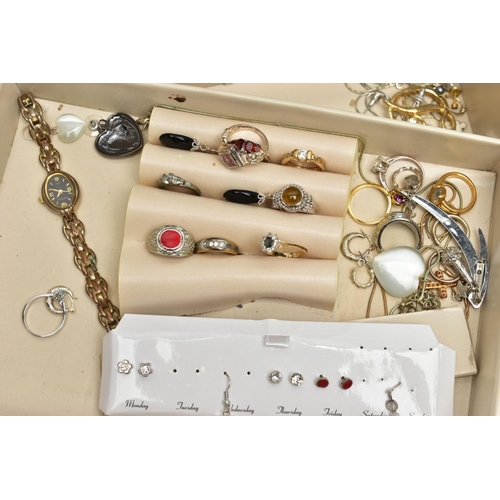 87 - A BOX OF ASSORTED COSTUME JEWELLERY, to include an assortment of dress rings, earrings, a ladies wri... 