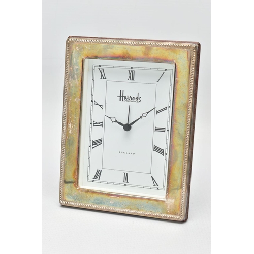 95 - A SILVER 'HARRODS' MANTLE CLOCK,  a rectangular form clock, white face signed 'Harrods Knightsbridge... 