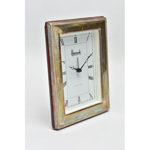 95 - A SILVER 'HARRODS' MANTLE CLOCK,  a rectangular form clock, white face signed 'Harrods Knightsbridge... 