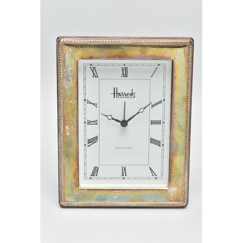 95 - A SILVER 'HARRODS' MANTLE CLOCK,  a rectangular form clock, white face signed 'Harrods Knightsbridge... 