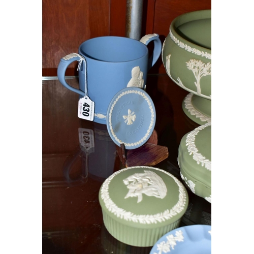 430 - THIRTEEN PIECES OF WEDGWOOD JASPERWARE, mostly in green, including a pale blue limited edition lovin... 