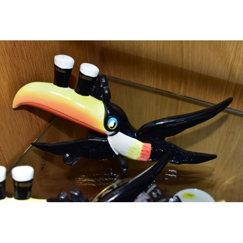 447 - A SET OF THREE REPRODUCTION GUINNESS FLYING TOUCANS, modern reproductions in graduating sizes, lengt... 