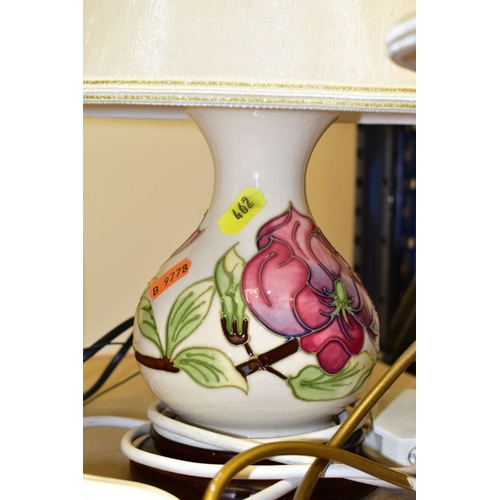 462 - TWO MOORCROFT POTTERY TABLE LAMPS WITH CREAM SHADES, comprising a coral 'Hibiscus' design on a dark ... 