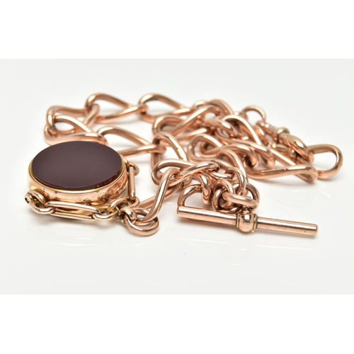 10 - AN EARLY 20TH CENTURY 9CT GOLD ALBERT CHAIN AND HARDSTONE SWIVEL FOB, rose gold Albert chain designe... 