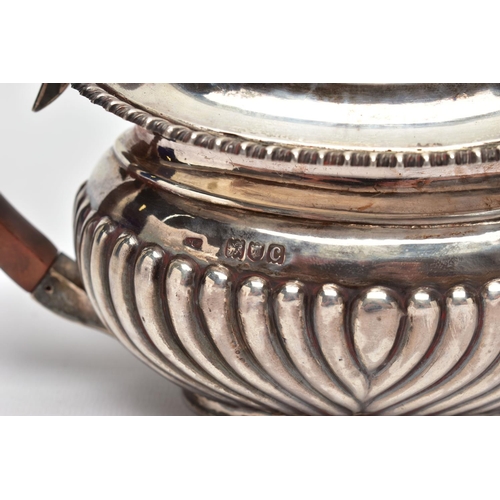 107 - A LATE VICTORIAN SILVER BACHELOR'S TEA POT OF ROUNDED RECTANGULAR FORM AND A GEORGE V SILVER CIRCULA... 