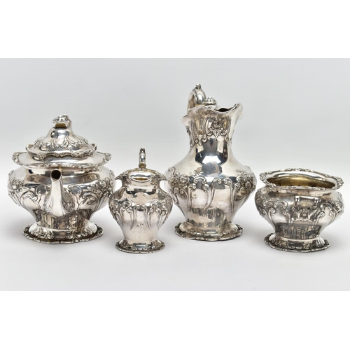 117 - AN EDWARDIAN SCOTTISH SILVER FOUR PIECE BACHELOR'S TEA SERVICE OF CIRCULAR, comprising tea pot, hot ... 