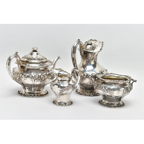 117 - AN EDWARDIAN SCOTTISH SILVER FOUR PIECE BACHELOR'S TEA SERVICE OF CIRCULAR, comprising tea pot, hot ... 