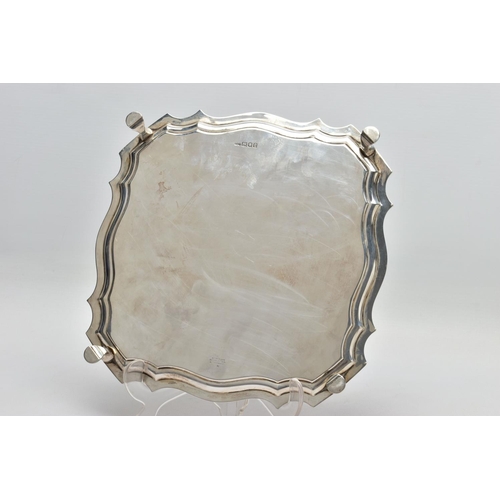 118 - A GEORGE V SILVER SALVER OF SHAPED SQUARE OUTLINE, pie crust edge, plain surface, four hoof feet, ma... 