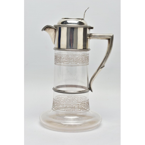 119 - A LATE VICTORIAN SILVER MOUNTED GLASS CLARET JUG, the hinged cover with foliate pierced thumbpiece, ... 