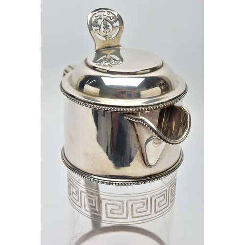 119 - A LATE VICTORIAN SILVER MOUNTED GLASS CLARET JUG, the hinged cover with foliate pierced thumbpiece, ... 