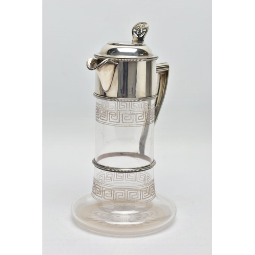 119 - A LATE VICTORIAN SILVER MOUNTED GLASS CLARET JUG, the hinged cover with foliate pierced thumbpiece, ... 