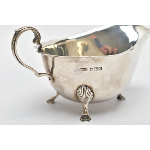 122 - A CASED PAIR OF GEORGE VI SILVER SAUCEBOATS, of oval form, S scroll handles, wavy rims, three cabrio... 