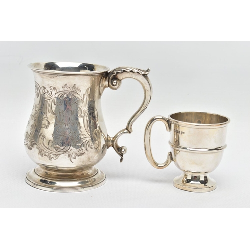 124 - A VICTORIAN SILVER BALUSTER TANKARD, S scroll handle with leaf shaped thumb rest, foliate engraved b... 