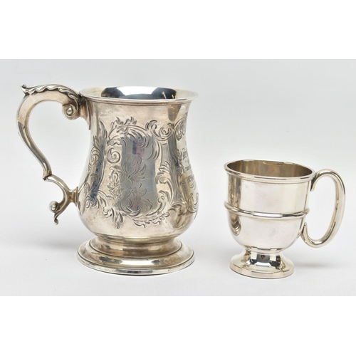 124 - A VICTORIAN SILVER BALUSTER TANKARD, S scroll handle with leaf shaped thumb rest, foliate engraved b... 