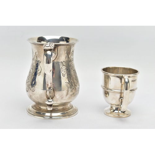 124 - A VICTORIAN SILVER BALUSTER TANKARD, S scroll handle with leaf shaped thumb rest, foliate engraved b... 