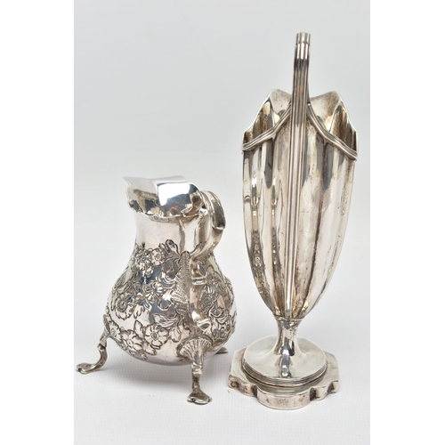 125 - TWO 18TH CENTURY SILVER CREAM JUGS, comprising a George III helmet shaped pedestal cream jug with re... 