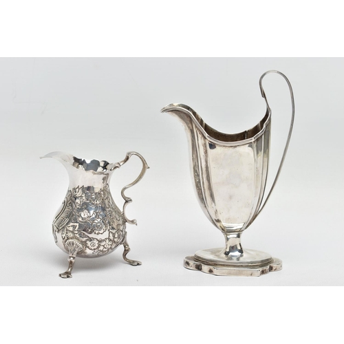 125 - TWO 18TH CENTURY SILVER CREAM JUGS, comprising a George III helmet shaped pedestal cream jug with re... 