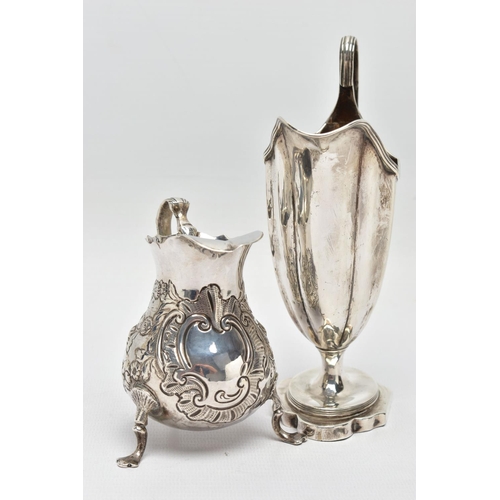 125 - TWO 18TH CENTURY SILVER CREAM JUGS, comprising a George III helmet shaped pedestal cream jug with re... 