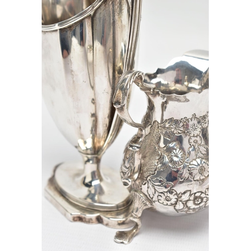 125 - TWO 18TH CENTURY SILVER CREAM JUGS, comprising a George III helmet shaped pedestal cream jug with re... 