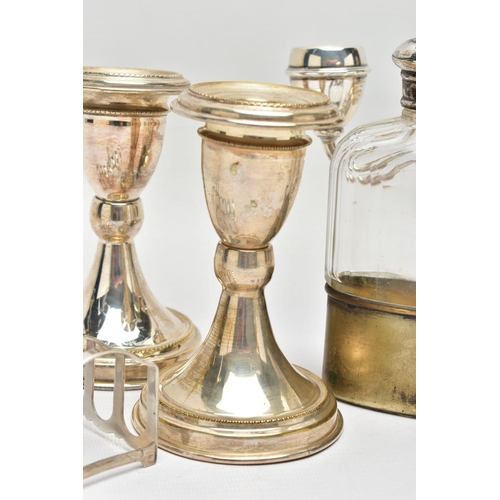 127 - EARLY TO MID 20TH CENTURY SILVERWARE, the first a three branch silver candle stick, tapered stem lea... 