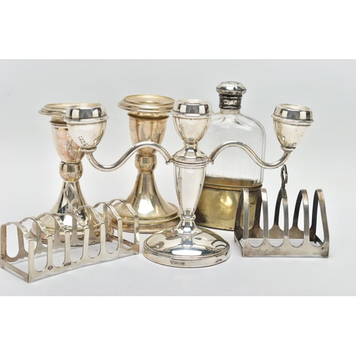 127 - EARLY TO MID 20TH CENTURY SILVERWARE, the first a three branch silver candle stick, tapered stem lea... 