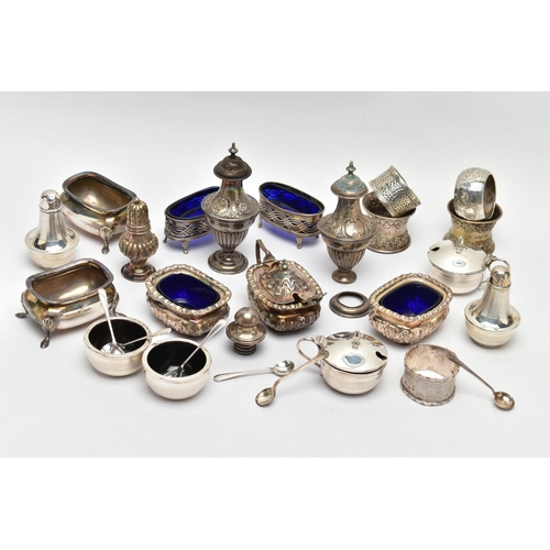 130 - AN ASSORTMENT OF EARLY 20TH CENTURY SILVER CONDIMENTS SETS AND NAPKIN RINGS, to include two matching... 