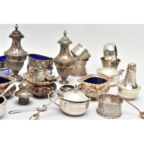 130 - AN ASSORTMENT OF EARLY 20TH CENTURY SILVER CONDIMENTS SETS AND NAPKIN RINGS, to include two matching... 