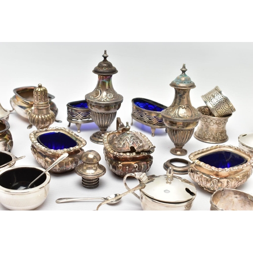 130 - AN ASSORTMENT OF EARLY 20TH CENTURY SILVER CONDIMENTS SETS AND NAPKIN RINGS, to include two matching... 