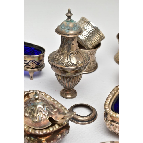 130 - AN ASSORTMENT OF EARLY 20TH CENTURY SILVER CONDIMENTS SETS AND NAPKIN RINGS, to include two matching... 