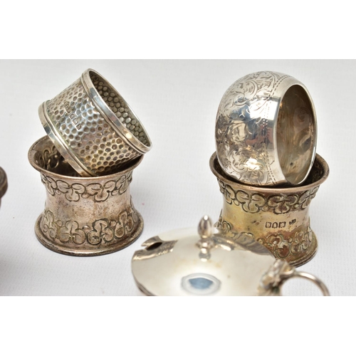 130 - AN ASSORTMENT OF EARLY 20TH CENTURY SILVER CONDIMENTS SETS AND NAPKIN RINGS, to include two matching... 