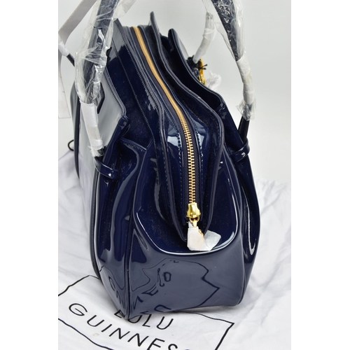 133 - AN UNUSED LULU GUINNESS 'FRANKA' PATENT LEATHER MIDNIGHT BLUE HANDBAG, striped black and stone fabri... 