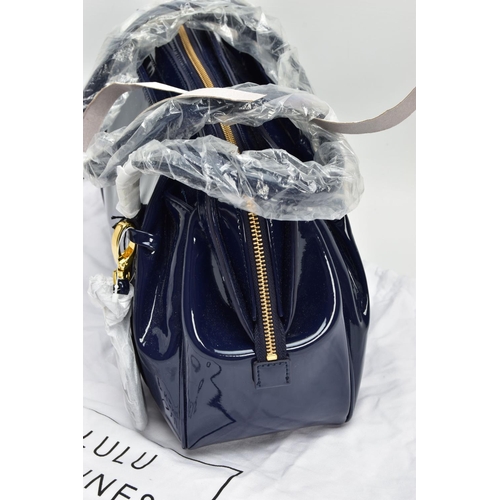 133 - AN UNUSED LULU GUINNESS 'FRANKA' PATENT LEATHER MIDNIGHT BLUE HANDBAG, striped black and stone fabri... 