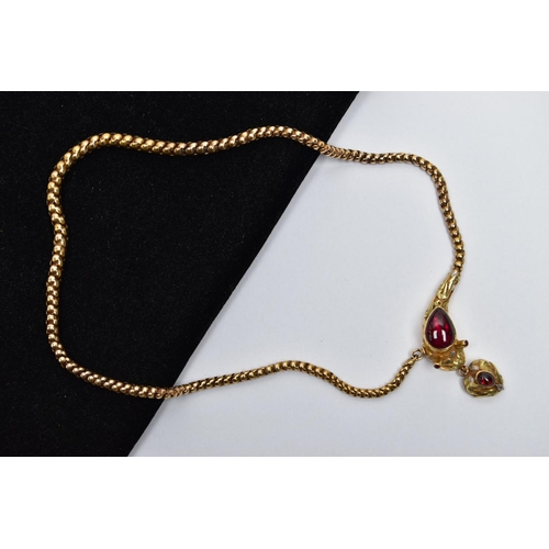 14 - A VICTORIAN GARNET SET GOLD SNAKE NECKLACE, the serpent's head set with a pear shape garnet cabochon... 