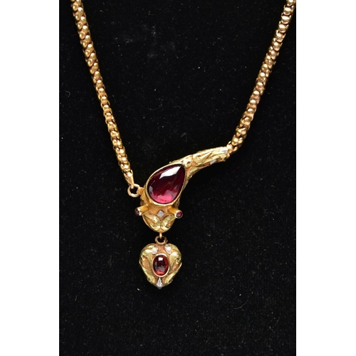 14 - A VICTORIAN GARNET SET GOLD SNAKE NECKLACE, the serpent's head set with a pear shape garnet cabochon... 